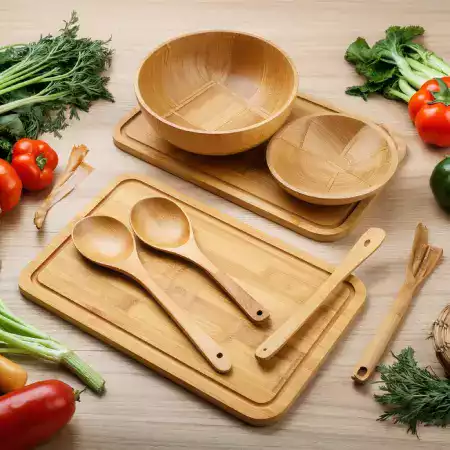 Professional chef in restaurant kitchen using EcoChefBamboo bamboo utensils for food preparation, showcasing the durability and versatility of our handcrafted kitchen tools in commercial settings