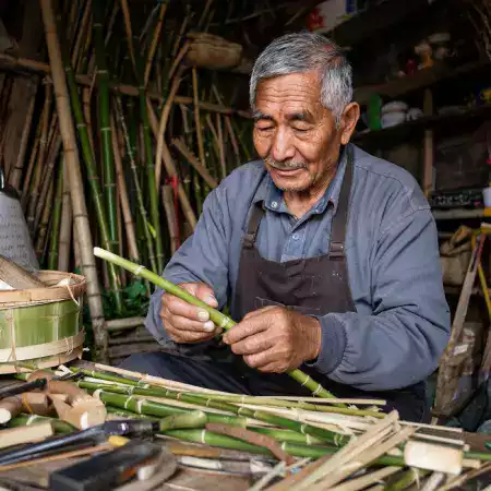 Master artisan from Nagaland carefully hand-carving bamboo kitchenware using traditional tools and techniques passed down through generations